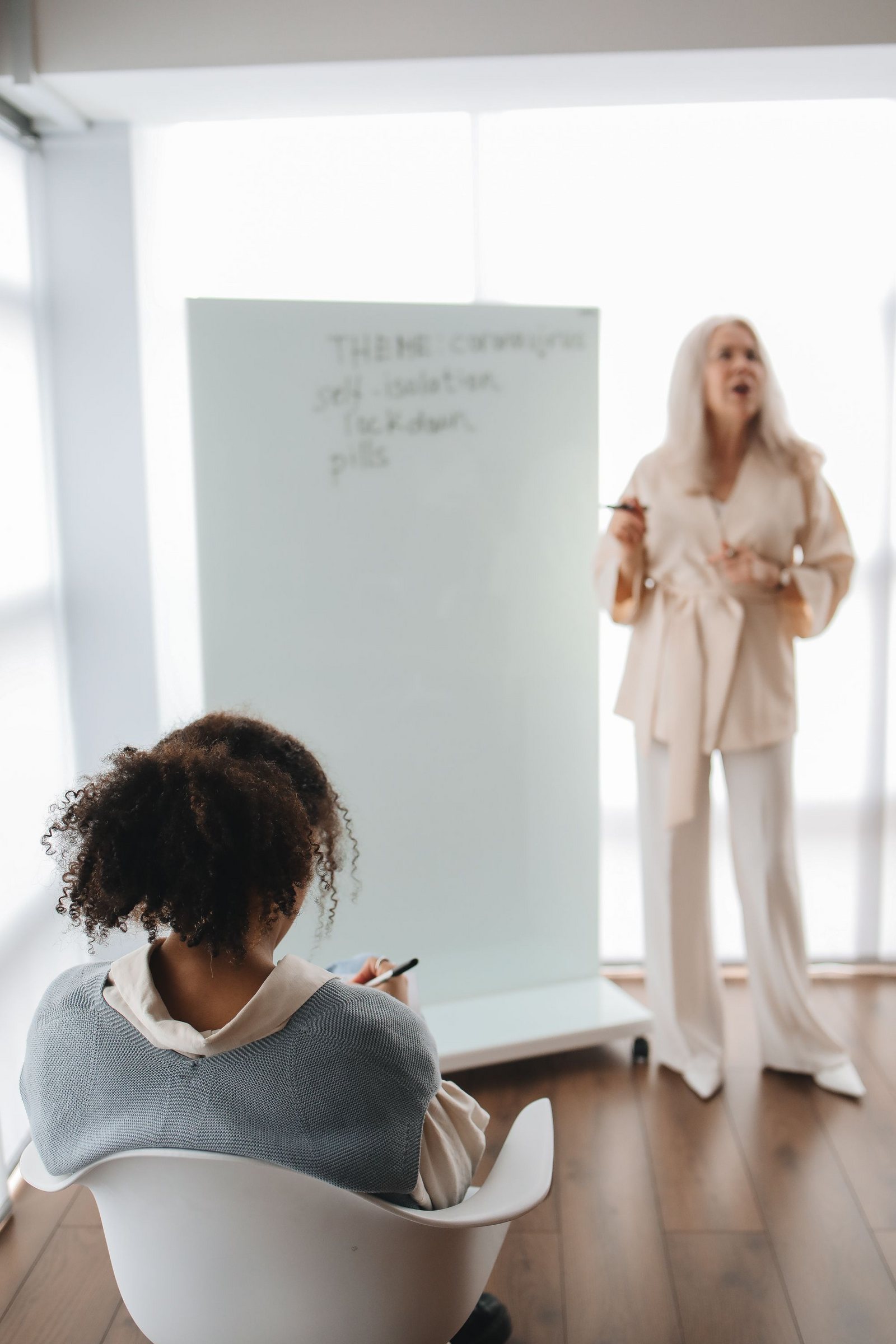 A mentor working one-on-one with a student